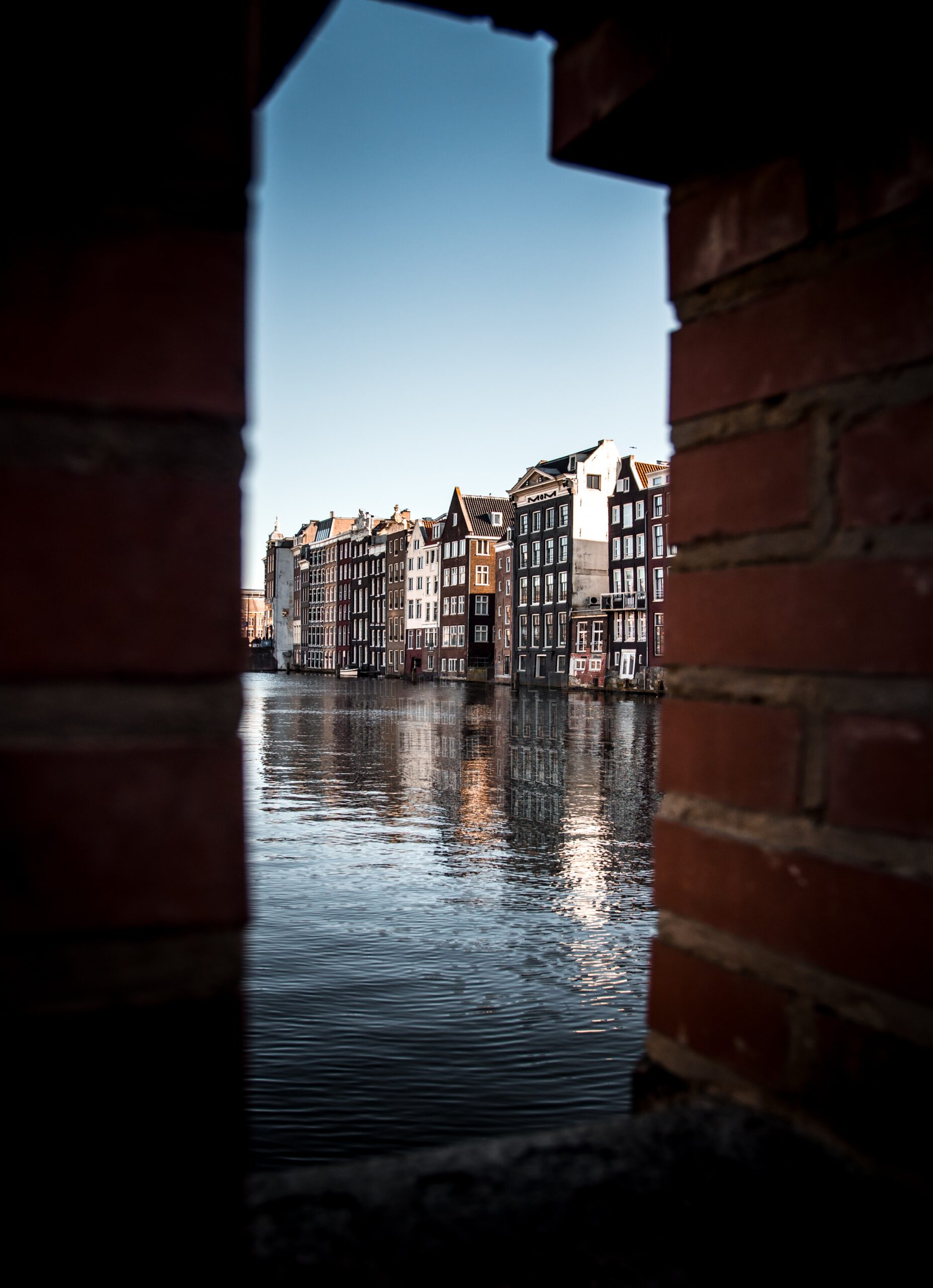Photo by Bruno van der Kraan buildings near body of water